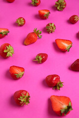 Fresh ripe strawberries on pink background, closeup