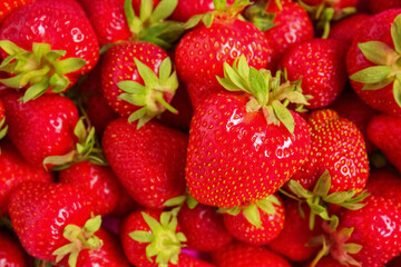 Texture of fresh ripe strawberries as background, closeup