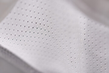 Macro detail of white breathable perforated fabric for sportswear