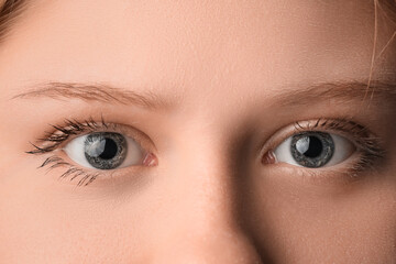 Fototapeta premium Young woman with beautiful eyes, closeup