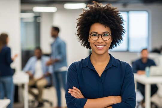 Confident businesswoman smiles in modern office
