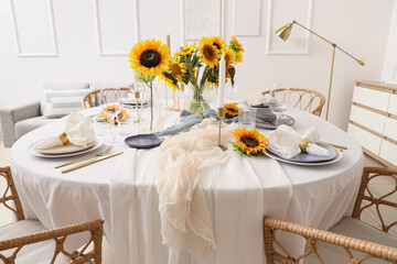 Elegant table serving with plates, folded napkins and beautiful sunflowers