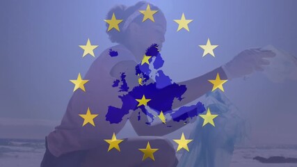 Animation of flag of eu over volunteer cleaning beach - Powered by Adobe