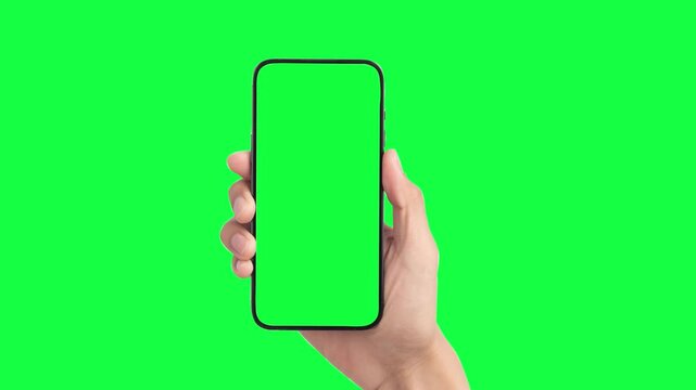 Woman hand holding the smartphone on green screen chroma key background. Phone, green screen, green screen of phone, smartphone green screen, 
animation hand and mobile phone mockup 