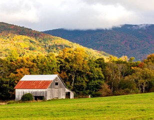 Obraz premium Autumnal barn nestled in valley (1)