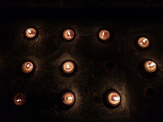 Glow of the candlelight on ground base of Thai temple for celebration and worship