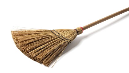 Close-up of a traditional broom with natural bristles on a white background, ideal for cleaning