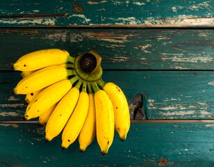 Bunch of bananas on rustic wood