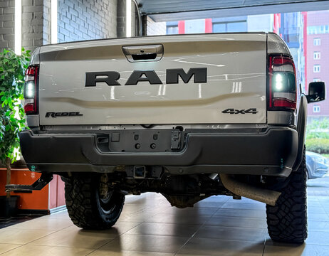 The silver Dodge Ram Rebel SUV is in the showroom, front view. Powerful American pickup Dodge Ram Rebel logo on the trunk lid. Dodge Ram Rebel 2500 Turbo diesel.