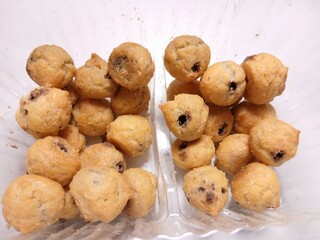   profiterole with chocolate filling on a white background