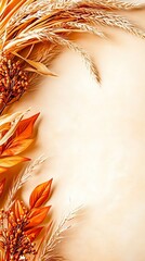 Beige background decorated with autumn wheat, orange leaves and berries makes a perfect fall banner with copy space for harvest invitations or thanksgiving greetings