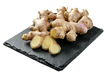 Fresh Ginger Root Slices on Dark Slate