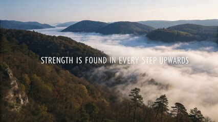 Foggy mountain landscape with inspiring quote on resilience and strength