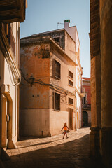 Picturesque alley in Nardò historic center with golden summer light