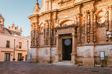 Upper facade of Chiesa di San Domenico in Nardò with ornate statues