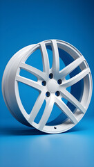 Obraz premium A striking, high-contrast studio shot of a pristine, matte white multi-spoke car alloy wheel, presented at a dynamic angle on a smooth