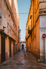Deep perspective view of narrow alley in Nardò old town