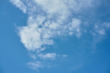 Beautiful Puffy White Clouds Drifting Across a Bright Blue Sky on a Sunny Day Creating a Picturesque Natural Scene