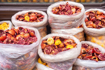 Plastic Bags Filled with Discarded Pomegranate and Orange Pulp After Juice Extraction