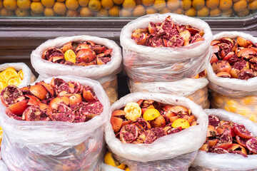 Plastic Bags Filled with Discarded Pomegranate and Orange Pulp After Juice Extraction
