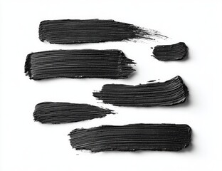 Dark streaks of cosmetic product on white background