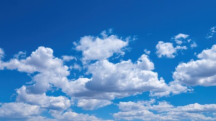 Obraz premium Bright Summer Sky with White Cumulus Clouds