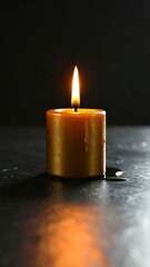 Single Golden Candle Flame on Dark Surface, Reflection, Still Life.