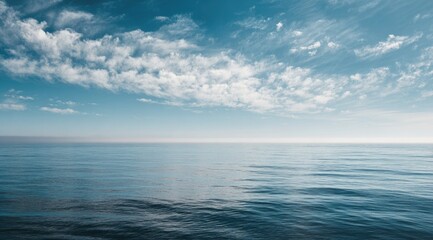 Vast expanse of tranquil ocean meeting a serene sky