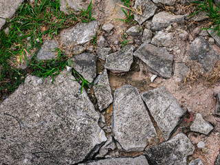 Cracked Concrete Floor with Chunky Fractures Texture Background.