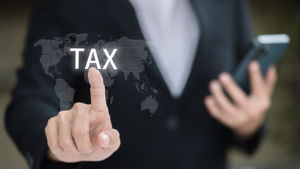 Businessman Touching Virtual TAX Icon on Digital World Map