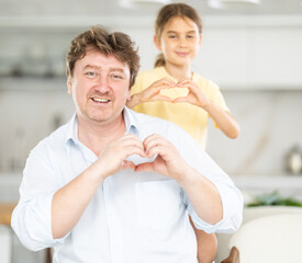 Fototapeta premium Father and daughter posing in kitchen at home