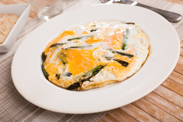 Scrambled eggs with asparagus for breakfast