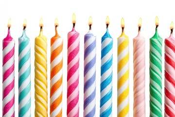 Row of colorful birthday candles with lit flames