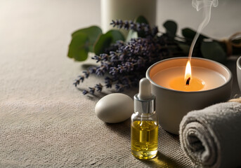 A collection of spa-related items on a textured surface