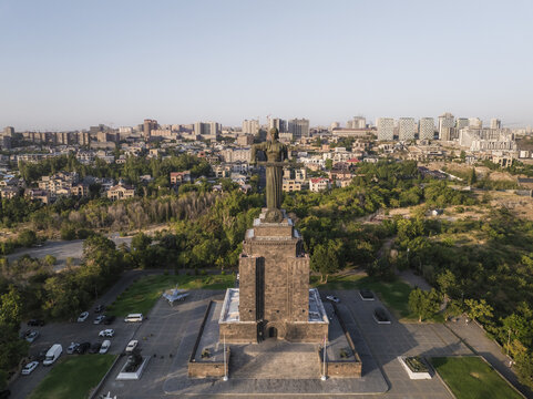 Aerial view of the majestic Mother Armenia statue standing tall against the urban sprawl, a harmonious blend of history and modernity, Yerevan, Yerevan, Armenia.