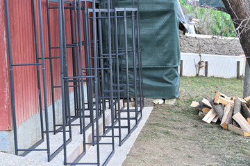 Iron decorative firewood stands for winter near house 
