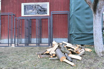 Iron decorative firewood stands for winter near house 