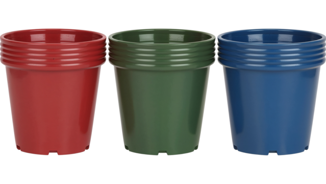 Vibrant trio of red, green, and blue plastic flower pots ready for spring planting in your garden, offering a colorful start to the season