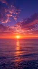 Fototapeta premium Radiant Sunset Over the Tranquil Ocean A Symphony of Color and Light Reflecting on the Calm Waters
