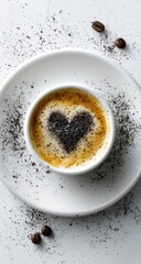 Heart-shaped latte art on a white saucer