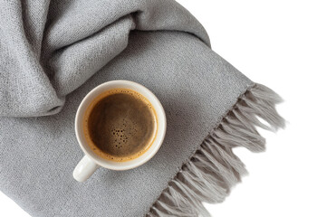 A cup of coffee on a gray blanket