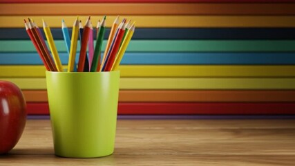 Apple and colored pencils against rainbow striped backdrop art and education still life - Powered by Adobe