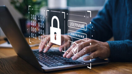 Hands typing on laptop with security lock, password, and data protection concept
