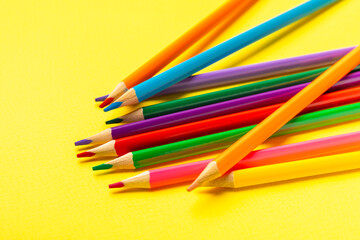 Colored pencils on a bright colored background. Equipment for coloring. Stationery for creativity.Back to school. Flatlay. Children's Creativity and Education. Rainbow.Space for text. Copy space.