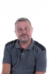 portrait confident middle-aged man with gray hair smiling gently wearing a motorcycle rugby gray shirt polo