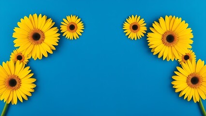 Vibrant yellow gerbera daisies arranged in geometric pattern against deep blue background.