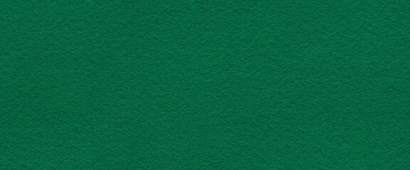 Richly seamless textured green felt surface exudes a sense of warmth and depth, inviting tactile...