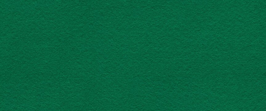 Richly seamless textured green felt surface exudes a sense of warmth and depth, inviting tactile exploration - Powered by Adobe