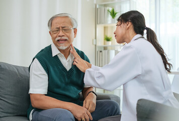 Obraz premium Doctor Examining Neck Injury of Senior Patient During Clinic Visit