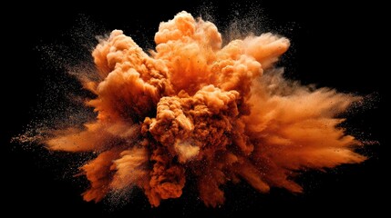 High quality photo of vibrant orange powder explosion against a black background.
